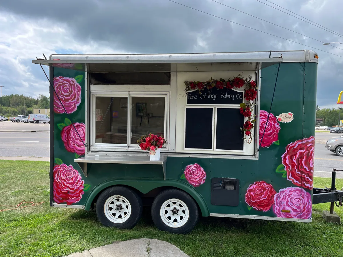 Rose Cottage Baking Co. food truck service window and chalkboard menu
